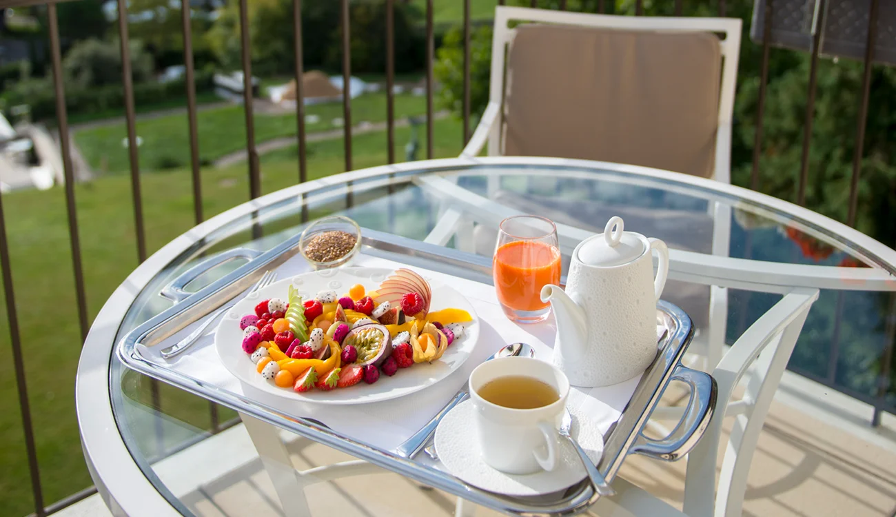 luxury breakfast enjoyed in the Alpine sunshine as part of a bespoke wellness and hiking safari programme in the Swiss Alps