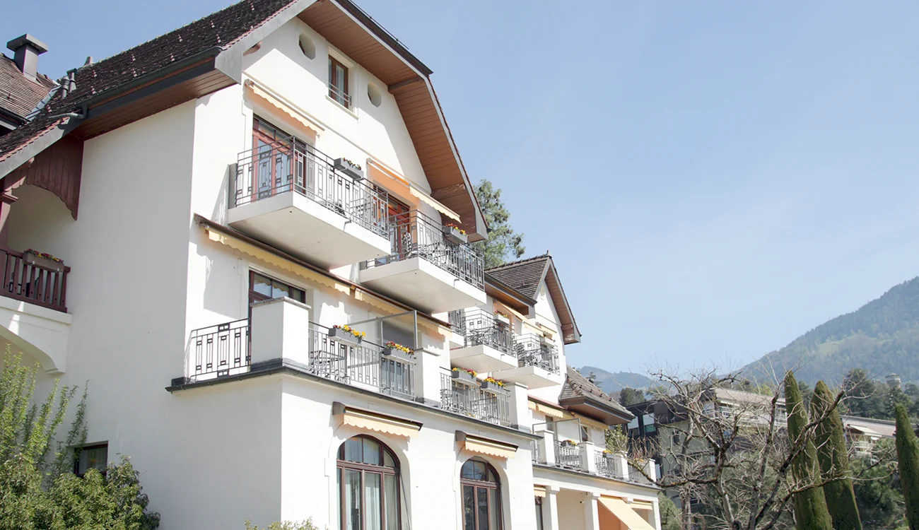 Luxury accommodation at a Swiss wellness clinic with stunning Alpine views as part of a bespoke hiking and wellness safari programme