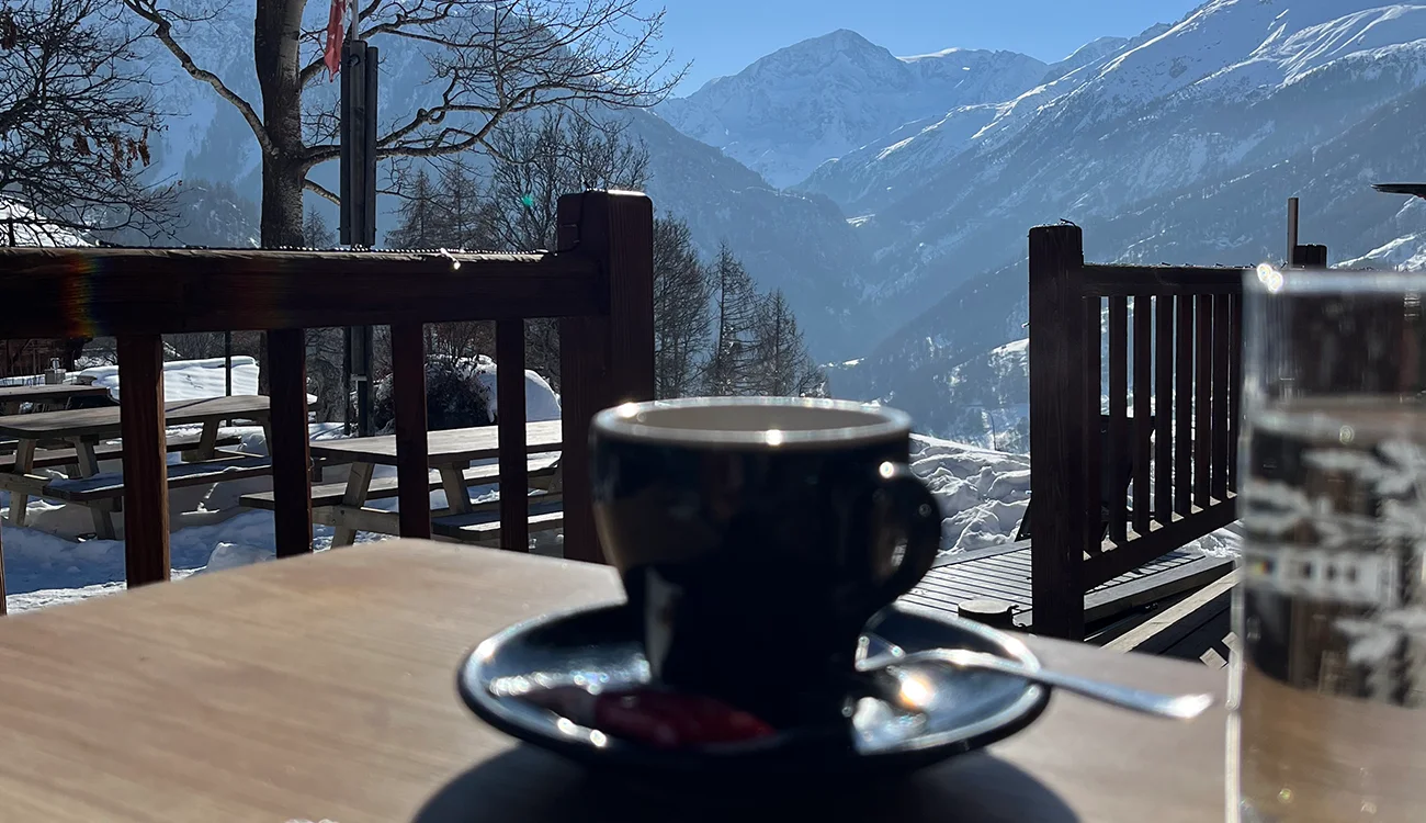 Ski-Touring-Safari-Coffee-Winter-Sun-Alps Coffee cup outside on a sunny winter day during a ski touring safari