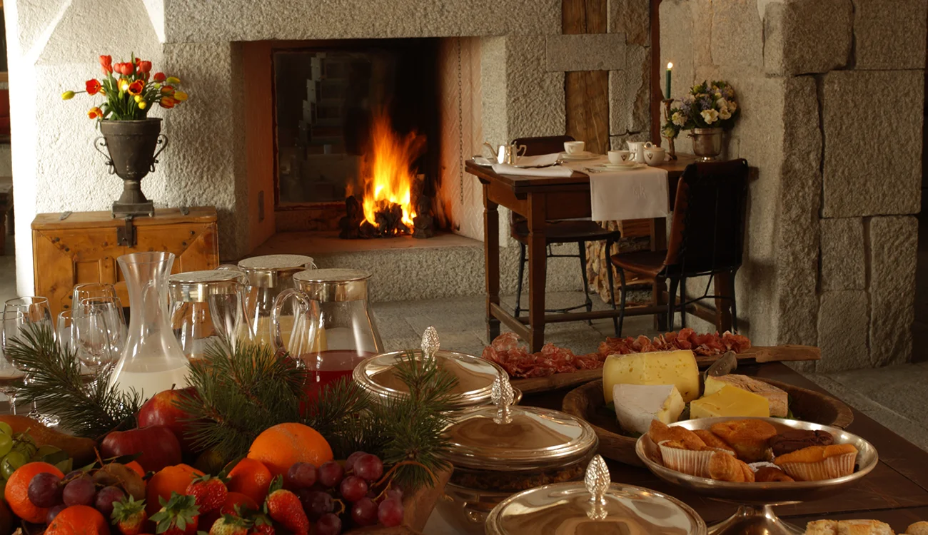 breakfast-buffet-by-the-fireplace Breakfast buffet spread in front of a cozy fireplace at our luxury ski touring base