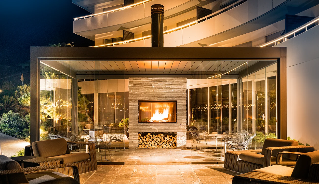 luxury-alpine-chalet-fireplace-interior-switzerland Cozy fireplace and elegant interior of a luxury Alpine chalet